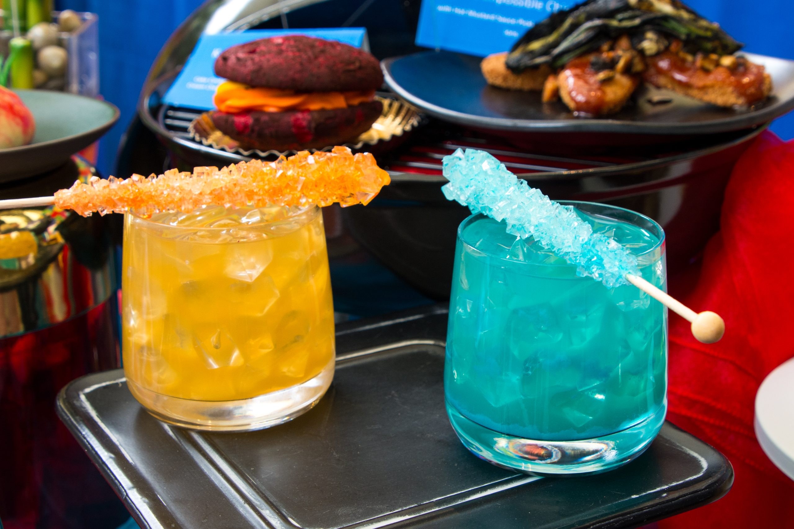 Two themed drinks from Elemental Table Marketplace at Pixar Fest